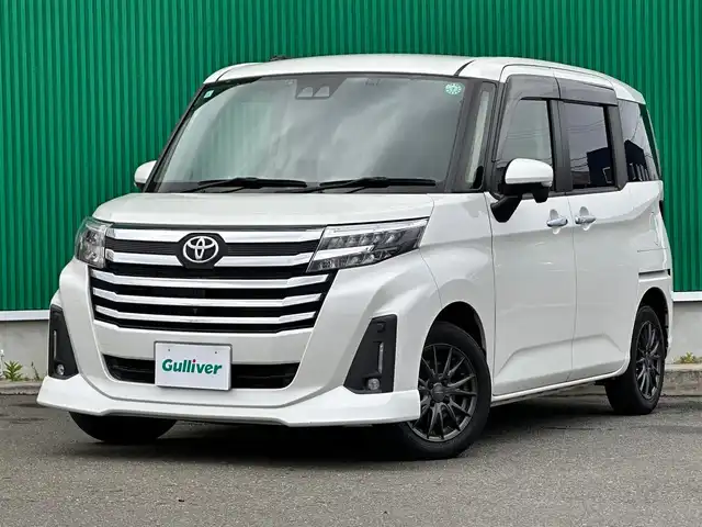 トヨタ ルーミー カスタムG 宮城県 2021(令3)年 5.3万km パールホワイトⅢ パノラミックビュー対応ナビレディパッケージ/・パノラミックビューモニター/・ステアリングスイッチ/コンフォートパッケージ/・シートヒーター（運転席/助手席）/・シートバックテーブル（運転席/助手席）/＝＝＝/スマートアシスト/・衝突回避支援ブレーキ機能/・車線逸脱警報機能/・ブレーキ制御付誤発進抑制機能/・先行車発進お知らせ機能/・アダプティブクルーズコントロール/・アダプティブドライビングビーム/・衝突警報機能/・ふらつき警報機能/・サイドビューランプ/・コーナーセンサー/・路側逸脱警報/・標識認識機能/社外9インチナビ（AVIC-RQ911）/・CD/DVD/・Bluetooth/・フルセグTV/ビルトインETC/両側パワースライドドア/革調シートカバー/革巻きステアリング/ステアリングスイッチ/電動パーキングブレーキ/ブレーキホールド/LEDヘッドランプ/フォグランプ/オートライト/スマートキー＆プッシュスタート/電動格納ミラー/純正14インチAW/純正フロアマット/純正ドアバイザー/Wエアバッグ