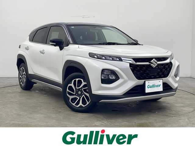 スズキ フロンクス 秋田県 2024(令6)年 0.9万km 白Ⅱ ４ＷＤ/純正ナビ/　(AM/FM/フルセグTV/Bluetooth/USB)/全方位カメラ/アダプティブクルーズコントロール/ハーフレザーシート/前席シートヒーター/ワイヤレス充電/ヘッドアップディスプレイ/ヒルディセントコントロール/オートブレーキホールド/プッシュスタート/スマートキー/パドルシフト/オートライト/LEDヘッドライト/AW付スタッドレス積込