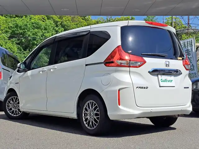 ホンダ フリード ハイブリット G ホンダセンシング 大阪府 2020(令2)年 3.5万km プラチナホワイトパール /禁煙車/ホンダセンシング搭載車//ワンオーナー//スペアキー×1//両側パワースライドドア//ディーラー純正SDナビ/VXM-207VFNi//Bluetooth/CD/DVD/USB/iPod//フルセグテレビ/バックカメラ//アクティブクルーズコントロール//ロールサンシェイド//前後純正ドライブレコーダー//ツイーター/ALPINE/STE-G170S//ドアバイザー//社外15インチアルミホイール/Exceeder//LEDヘッドライト//D＋N席シートヒーター