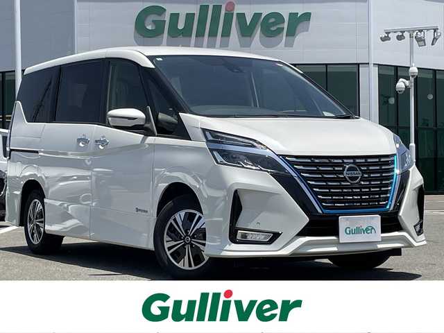 日産 セレナ e－パワー ハイウェイスター V 佐賀県 2021(令3)年 2.7万km ブリリアントホワイトパール 純正10インチナビ/・フルセグTV/CD/DVD/フリップダウンモニター/バックカメラ/両側パワースライドドア/前後ドライブレコーダー/ビルトインETC/電子パーキングブレーキ/AUTO HOLD機能/後席用サイドサンシェード/革巻きステアリング/ステアリングリモコン/ウィンカーミラー/LEDフォグライト/純正LEDヘッドライト/純正15インチアルミ/純正フロアマット/プロパイロット/・インテリジェントクルーズコントロール/・レーンディパーチャーワーニング/・ブラインドスポットワーニング/・エマージェンシーブレーキ/・クリアランスソナー/・標識認識機能/新車時保証書/取扱説明書