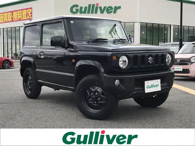 スズキ ジムニー XL 鳥取県 2021(令3)年 1.5万km ブルーイッシュブラックパール3 ワンオーナー/４WD・ターボ車/社外10インチディスプレイオーディオ/BT/ドライブレコーダー前方のみ/前席シートヒーター/フォグライト/純正16インチホイール/プッシュエンジンスタート/アイドリングストップ/背面タイヤ/スタットレスセット積込/（タイヤ溝　６－７部山）/フロアマット/背面タイヤカバー/保証書・取扱説明書