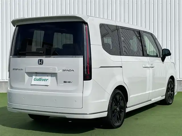 ホンダ ステップワゴン スパーダ eHEV 香川県 2025(令7)年 0.1千km プラチナホワイトパール 純正11.4インチメモリーナビ/→AM/FM/CD/DVD/Bluetooth/フルセグTV/バックカメラ/レーダークルーズコントロール/レーンキープアシスト/両側パワースライドドア/パワーバックドア/シートヒーター/LEDヘッドライト/ホンダセンシング/オットマン/コーナーセンサー/プッシュスタート/スマートキー/スペアキー×1/ステアリングスイッチ/サンシェード/革巻きステアリング/横滑り防止装置