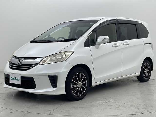 ホンダ フリード G ジャストセレクション 宮城県 2014(平26)年 3.2万km ホワイトオーキッドパール 禁煙車/純正7型インターナビ/・BT.CD.DVD.SD/・ワンセグTV/バックカメラ/片側パワースライドドア/ビルトインETC/ドライブレコーダー（FR）/ステアリングスイッチ/スマートキー/横滑り防止/アイドリングストップ/純正フロアマット/純正ドアバイザー/社外15インチAW/３列シート/オートライト/オートエアコン