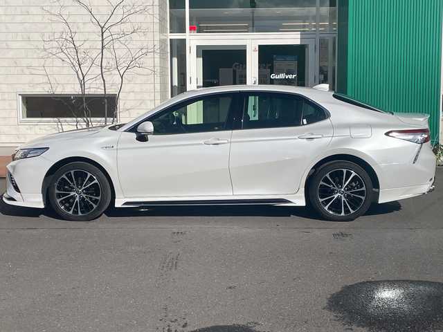 トヨタ カムリ WSレザーパッケージ 青森県 2019(令1)年 4.8万km プラチナホワイトパールマイカ 4WD/寒冷地仕様/純正Tコネクトナビ・フルセグTV/Bluetooth・Miracast/バックカメラ/本革シート/前席パワーシート・シートヒーター/ヘッドアップディスプレイ/セーフティセンス/プリクラッシュセーフティ/レーダークルーズコントロール/レーンディパーチャーアラート/オートマチックハイビーム/ブラインドスポットモニター/インテリジジュントクリアランスソナー/前後ドライブレコーダー/ビルトインETC/パドルシフト/ワイパーデアイサー/LEDヘッドライト/オートライト/LEDフォグランプ/リアフォグランプ/純正18インチアルミ/TRDエアロ