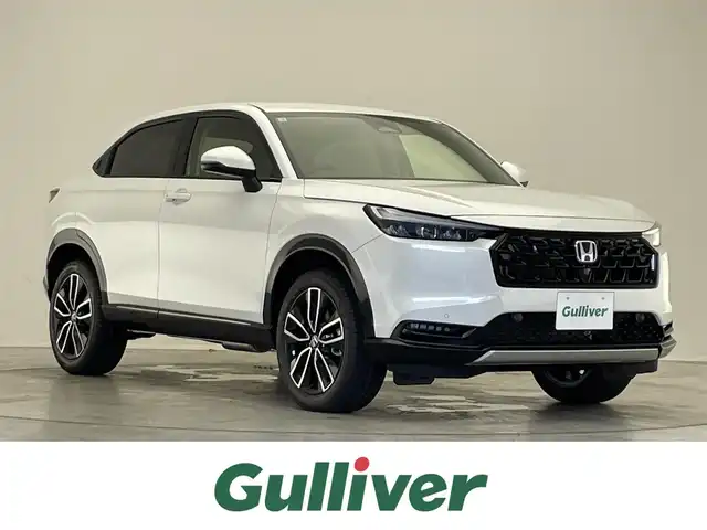 ホンダ ヴェゼル ハイブリッド e:HEV Z 滋賀県 2025(令7)年 0.1千km プラチナホワイトパール 登録済未使用車/純正8インチナビ/（Bluetooth/フルセグ/Apple CarPlay/Android Auto/USB）/純正ビルトインETC2.0/追従クルーズコントロール/バックカメラ/ブラインドスポットモニター/前後コーナーセンサー/運転席/助手席シートヒーター/レーンキープアシスト/オートハイビーム/ダウンヒルアシスト/カーテンエアバッグ/電動リアゲート/ステアリングリモコン/純正18インチアルミホイール/スマートキー/スペアキー