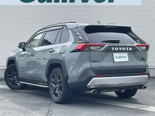 トヨタ ＲＡＶ４ ハイブリッド アドベンチャー 静岡県 2025(令7)年 0.4万km アーバンカーキ ●ワンオーナー/●純正10.5インチナビ/(フルセグ/Bluetooth)/●全方位カメラ/●JAOSフロントプロテクター/●JAOSピラープロテクター/●TRDマフラー/●モデリスタサイドステップ/●プリクラッシュセーフティ/●レーンキープアシスト/●レーダークルーズコントロール/●ブラインドスポットモニター/●前後クリアランスソナー/●電動パーキングブレーキ/●オートブレーキホールド/●電動リアゲート/●LEDヘッドライト/●フォグランプ/●オートライト/●オートマチックハイビーム/●革巻きステアリング/●ステアリングスイッチ/●ステアリングヒーター/●運転席パワーシート(シートメモリー付き)/●前席シートヒーター/●前後ドライブレコーダー/●デジタルインナーミラー/●ETC2.0/●純正フロアマット/●ドアバイザー/●トノカバー/●サンルーフ/●横滑り防止装置/●ISOFIX/●純正19インチアルミホイール/●W＋サイド＋カーテンSRS＋ABS/●保証書/●取扱説明書