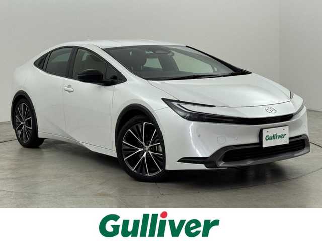 トヨタ プリウス G 福岡県 2023(令5)年 2万km プラチナホワイトパールマイカ 純正ＤＡナビ/フルセグTV　/全方位カメラ　/前方ドラレコ　/レーダー探知機　/ビルトインＥＴＣ２．０　/トヨタセーフティセンス　/レーダークルーズコントロール　/コーナーセンサー　/衝突軽減ブレーキ　/レーンキープ　/アクセル踏み間違い防止　/ブラインドスポットモニター　/寒冷地仕様　/シートヒーター　/純正１９インチＡＷ　/ＬＥＤヘッドライト