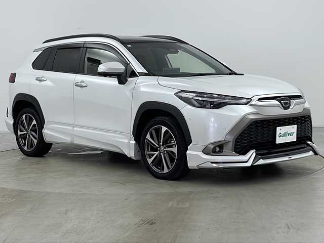 トヨタ カローラ クロス ハイブリッド Z 道央・札幌 2023(令5)年 1.2万km プラチナホワイトパールマイカ 4WD/純正ディスプレイオーディオ/フルセグテレビ/BluetoothAudio/純正18インチアルミホイール/モデリスタフルエアロ/プリクラッシュセーフティ/クルーズコントロール/ブラインドスポットモニター/車線逸脱警報アラート/アラウンドビューモニター/レーンキープアシスト/パーキングアシスト/ステアリングスイッチ/横滑り防止システム/ブレーキホールド/コーナーセンサー/パノラマルーフ/純正フロアマット/ハーフレザー/シートヒーター/LEDオートライト/オートハイビーム/フォグランプ/前後ドラレコ/ETC2.0