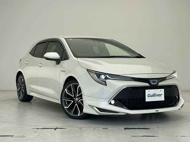 トヨタ カローラ スポーツ ハイブリッドG Z 沖縄県 2019(平31)年 5万km ホワイトパールクリスタルシャイン モデリスタエアロ　/純正９インチナビ(NSZT-Y68T)/(フルセグＴＶ　ＤＶＤ　ＢＴ接続)/バックカメラ　/ＥＴＣ　/前後ドラレコ　/トヨタセーフティセンス(ＴＳＳ)　/ブラインドスポットモニター(ＢＳＭ)　/ステアリングスイッチ　/ＵＳＢポート　/スマートキー　/ドアバイザー　/純正フロアマット　/ウィンカーミラー