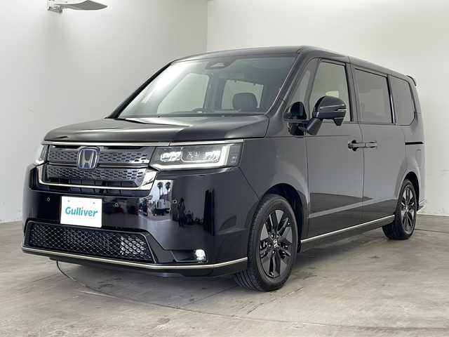 ホンダ ステップワゴン スパーダ eHEV 兵庫県 2025(令7)年 0.1千km クリスタルブラックパール ・登録済未使用車/・11.4インチナビHonda CONNECTナビ /（フルセグ・DVD・CD・BT・SD・HDMI）/・両側パワースライドドア/・パワーバックドア/・ホンダセンシング/・ブラインドスポットモニター/・急アクセル抑制機能/・トラフィックジャムアシスト/・衝突軽減ブレーキ/・先行車発進お知らせ機能/・歩行者事故低減ステアリング/・路外逸脱抑制機能/・標識認識機能/・渋滞追従機能付アダクティブクルーズコントロール/・車線維持支援システム/・誤発進抑制機能/・後方誤発進抑制機能/・後退時出庫サポート/・近距離衝突軽減ブレーキ/・パーキングセンサーシステム/・オートハイビーム/・LEDヘッドライト/・パドルシフト/・純正16インチアルミホイール/・電動パーキングブレーキ/・オートブレーキホールド/・スマートキー/・スペアキー/・プッシュスタート/・ヘッドライトレベライザー/・カーテンエアバック/・W＋サイドエアバック