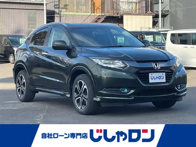 ホンダ ヴェゼル ハイブリッド Z 宮城県 2014(平26)年 12.4万km ミスティックグリーンパール (株)IDOMが運営する【じしゃロン仙台店】の自社ローン専用車両になりますこちらは現金またはオートローンご利用時の価格です。自社ローンご希望の方は別途その旨お申付け下さい/ハーフレザーシート/シートヒーター/メモリナビ/フルセグ/Bluetooth/バックカメラ/ETC/ルーフレール/衝突被害軽減システム/LEDヘッドライト