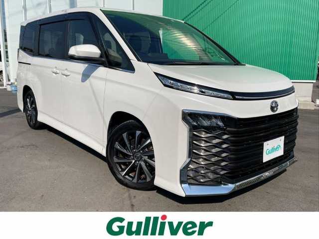 トヨタ ヴォクシー S－Z 岡山県 2022(令4)年 3.5万km ホワイトパールクリスタルシャイン 純正10.5インチディスプレイオーディオ/フルセグTV、CD、DVD、Bluetooth、AM、FM/Apple　Carplay、Android Auto、HDMI/純正14インチ有機ELフリップダウンモニター/V14T-R72R/ビルトインETC2.0/バックカメラ/両側パワースライドドア/前後ドライブレコーダーTZ-DR210/純正17インチアルミホイール/CD、DVDデッキ/前席シートヒーター/トヨタセーフティセンス/・プリクラッシュセーフティ/・レーントレーシングアシスト/・レーダークルーズコントロール/・ロードサインアシスト/・オートマチックハイビーム/・ドライバー異常時対応システム/・プロアクティブドライビングアシスト/・発進遅れ告知機能/パーキングサポートブレーキ/ドアバイザー/前後コーナーセンサー