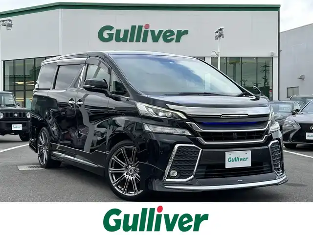 トヨタ ヴェルファイア Z Gエディション 愛媛県 2015(平27)年 8.6万km ブラック 登録時走行距離：85346Km/メーカーOP純正SDメモリーナビ/AM/FM/DVD/フルセグTV/BT/横滑り防止装置/盗難防止装置/純正ビルトインETC/エンジンスタートボタン/クルコン/ＡＢS/LEDヘッドライト/オートライト/両側パワスラ/スマートキー/ハンドルヒーター/純正フロアマット/社外アルミホイール