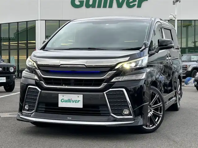トヨタ ヴェルファイア Z Gエディション 愛媛県 2015(平27)年 8.6万km ブラック 登録時走行距離：85346Km/メーカーOP純正SDメモリーナビ/AM/FM/DVD/フルセグTV/BT/横滑り防止装置/盗難防止装置/純正ビルトインETC/エンジンスタートボタン/クルコン/ＡＢS/LEDヘッドライト/オートライト/両側パワスラ/スマートキー/ハンドルヒーター/純正フロアマット/社外アルミホイール