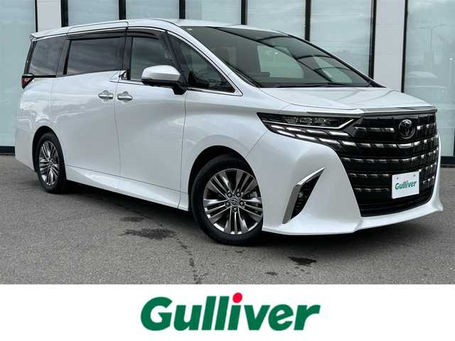トヨタ アルファード Z 大阪府 2024(令6)年 1.6万km プラチナホワイトパールマイカ トヨタセーフティセンス/純正14インチHDディスプレイオーディオPlus/　（AppleCarplay/AndroidAuto/フルセグTV/Bluetooth/USB）/パノラミックビューモニター/レザーシート（合皮）/　（エグゼクティブパワーシート/シートヒーター/ベンチレーション)/純正14インチフリップダウンモニター/ステアリングヒーター/前後ドライブレコーダー/両側パワースライドドア/パワーバックドア/後席ロールサンシェード/三眼LEDヘッドライト/ビルトインETC2.0/ブラインドスポットミラー/ヘッドアップディスプレイ/ワイヤレス充電/純正18インチアルミホイール/純正フロアマット/TVキャンセラー有