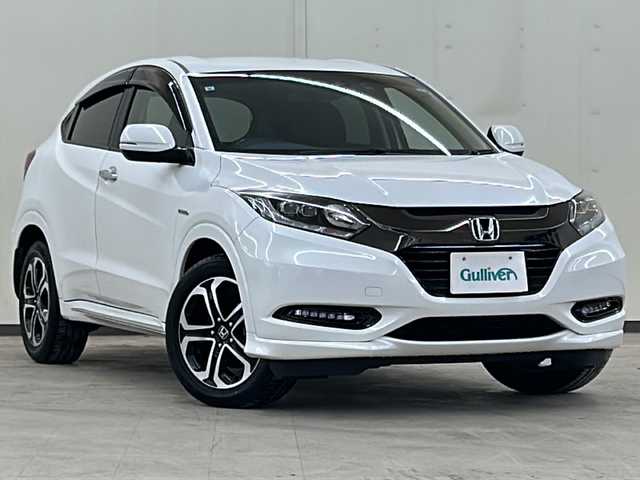 ホンダ ヴェゼル ハイブリッド Z ホンダセンシング 道央・札幌 2016(平28)年 5.4万km ホワイトオーキッドパール 純正メモリナビ・フルセグTV/DVD/CD/USB/SD/Bluetooth/バックカメラ/純正17インチアルミホイール/HONDA SENSING/・アダプティブクルーズコントロール（ACC）/・衝突軽減ブレーキ（CMBS）/・車線維持支援システム（LKAS）/・誤発進抑制機能/・先行車発進お知らせ機能/・オートハイビーム/4WD/ハーフレザーシート/シートヒーター/LEDライト/ビルトインETC/スマートキー/プッシュスタート/新車時保証書/取扱説明書