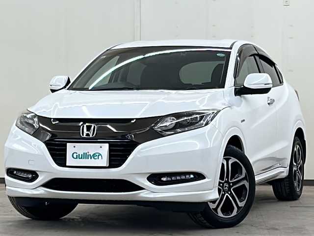 ホンダ ヴェゼル ハイブリッド Z ホンダセンシング 道央・札幌 2016(平28)年 5.4万km ホワイトオーキッドパール 純正メモリナビ・フルセグTV/DVD/CD/USB/SD/Bluetooth/バックカメラ/純正17インチアルミホイール/HONDA SENSING/・アダプティブクルーズコントロール（ACC）/・衝突軽減ブレーキ（CMBS）/・車線維持支援システム（LKAS）/・誤発進抑制機能/・先行車発進お知らせ機能/・オートハイビーム/4WD/ハーフレザーシート/シートヒーター/LEDライト/ビルトインETC/スマートキー/プッシュスタート/新車時保証書/取扱説明書