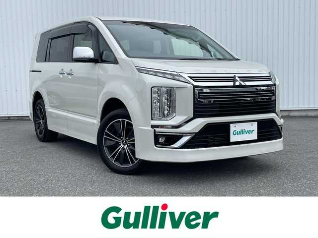 三菱 デリカＤ：５ アーバンギア Pエディション 滋賀県 2021(令3)年 0.7万km ウォームホワイトパール 純正ナビ/（Bluetooth／CD／DVD／USB／AUX／HDMI／iPod／フルセグTV）/アラウンドビューモニター/純正後席モニター/ビルトインETC/前方ドライブレコーダー/アダプティブクルーズコントロール/ブラインドスポットモニター/運転席側パワーシート/前席シートヒーター/ステアリングヒーター/パドルシフト/両側パワースライドドア/パワーバックドア/オートブレーキホールド/衝突被害軽減ブレーキ/AUTO STEP/アイドリングストップ/レーンキープアシスト/LEDヘッドライト/オートライト/オートマチックハイビーム/純正アルミホイール/純正フロアマット/プッシュスタート/スマートキー/ステアリングリモコン