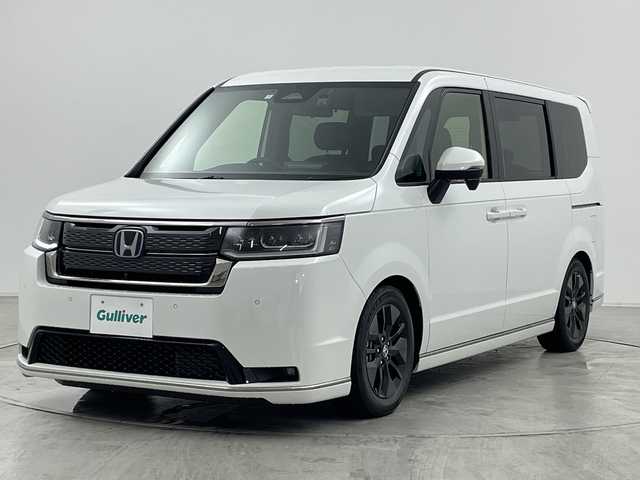 ホンダ ステップワゴン スパーダ eHEV 群馬県 2024(令6)年 0.5万km プラチナホワイトパール 純正１１．４型ナビ　純正１５．６型後席モニター　全周囲カメラ　ダウンサス　ハーフレザーシート　シートヒーター　前後ドラレコ　ＥＴＣ　アダプティブクルーズコントロール　両側電動スライドドア　禁煙車