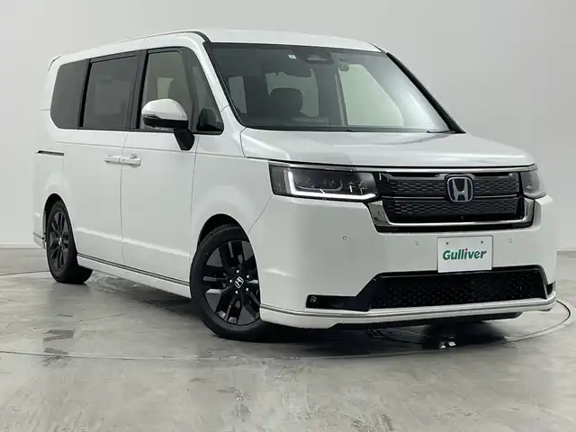 ホンダ ステップワゴン スパーダ eHEV 群馬県 2024(令6)年 0.5万km プラチナホワイトパール 純正１１．４型ナビ　純正１５．６型後席モニター　全周囲カメラ　ダウンサス　ハーフレザーシート　シートヒーター　前後ドラレコ　ＥＴＣ　アダプティブクルーズコントロール　両側電動スライドドア　禁煙車