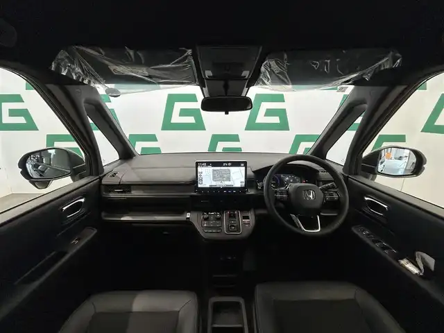 ホンダ ステップワゴン スパーダ eHEV 鹿児島県 2025(令7)年 0.1千km クリスタルブラックパール 登録済未使用車/純正ナビ/(フルセグ/Bluetooth/DVD/CD)/バックカメラ/前席シートヒーター/Honda　SENSING/　・衝突軽減ブレーキ/　・誤発進抑制機能/　・後方誤発進抑制機能/　・歩行者事故低減ステアリング/　・渋滞追従機能付アダプティブクルーズコントロール/　・車線維持支援システム/　・先行車発進お知らせ機能/　・標識認識機能/　・オートハイビーム/ブラインドスポットインフォメーション/パワーテールゲート/電動パーキングブレーキ/ブレーキホールド/本革巻きステアリング/パドルシフト/後席ロールサンシェード/バックテーブル/電動格納ミラー