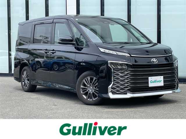 トヨタ ヴォクシー S－G 大阪府 2023(令5)年 2.4万km アティチュードブラックマイカ バックカメラ /Bluetooth /追従型クルーズコントロール /ディスプレイオーディオ　/片側電動パワースライドドア　/ETC2.0　/ミュージックプレーヤー　/MTモード付きAT　/CD/DVD再生機能付き　/プッシュスタート