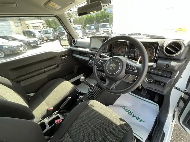 スズキ ジムニー XC 山形県 2022(令4)年 6.6万km ピュアホワイトP 4WD/社外SDナビ/フルセグTV/AM/FM/CD/DVD/Bluetooth/禁煙車/衝突軽減ブレーキ/クルーズコントロール/レーンキープアシスト/オートライト/横滑り防止装置/盗難防止装置/ターボ/ETC/プッシュスタート/スマートキー/シートヒーター/LEDヘッドライト/５MT/オートライト /フォグランプ/背面タイヤ/純正アルミ/ドアバイザー/保証書/取扱説明書