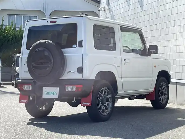 スズキ ジムニー XC 山形県 2022(令4)年 6.6万km ピュアホワイトP 4WD/社外SDナビ/フルセグTV/AM/FM/CD/DVD/Bluetooth/禁煙車/衝突軽減ブレーキ/クルーズコントロール/レーンキープアシスト/オートライト/横滑り防止装置/盗難防止装置/ターボ/ETC/プッシュスタート/スマートキー/シートヒーター/LEDヘッドライト/５MT/オートライト /フォグランプ/背面タイヤ/純正アルミ/ドアバイザー/保証書/取扱説明書
