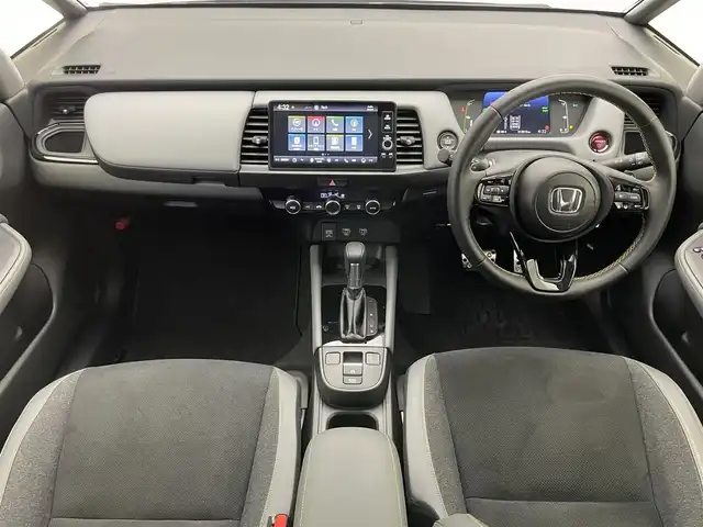 ホンダ フィット e:HEV RS 愛知県 2023(令5)年 1.2万km グレー 純正９型ディスプレイナビ　フルセグＴＶ　カープレイ対応　ハーフレザー　ＥＴＣ２．０　バックカメラ　リヤパーキングセンサー　ホンダセンシング　衝突軽減装置　追従クルコン　ハンドル支援　ＬＥＤイト　禁煙車