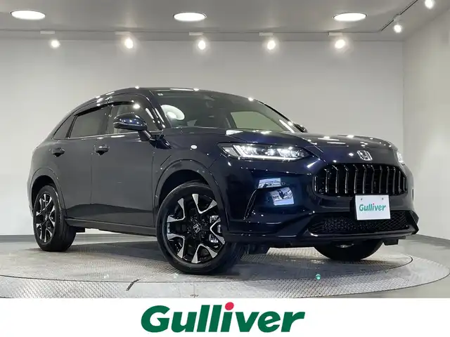 ホンダ ＺＲ－Ｖ ハイブリッド e:HEV Z 愛知県 2024(令6)年 0.8万km ミッドナイトブルービームM 純正９インチナビ/マルチビューカメラシステム/ＢＯＳＥサウンドシステム/衝突軽減ブレーキ/レーダークルーズコントロール/ブラインドスポットモニター/車線逸脱警報/クリアランスソナー/パワーバックドア/電動パーキングブレーキ/ワイヤレス充電/本革シート/パワーシート【メモリー機能付】/シートヒーター/ハンドルヒーター/パドルシフト/前後ドライブレコーダー/ビルトインＥＴＣ2.0/アクセサリーソケット/USB入力端子/ISOFIX/純正フロアマット/純正18インチアルミホイール