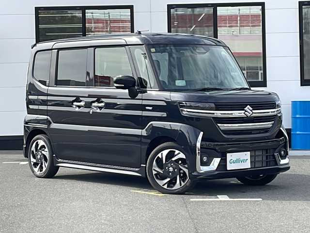 スズキ スペーシア カスタム HYBRID XS 山口県 2023(令5)年 0.1万km ブルーイッシュブラックパール3 両側パワースライドドア/プッシュスタート/スマートキー（スペアキー有）/シートヒーター（運転席＋助手席）/ステアリングヒーター/ヘッドアップディスプレイ/USB入力端子×２/オートエアコン/オートライト/LEDヘッドライト/フォグライト/サーキュレーター/アームレストコンソールボックス/助手席シートアンダーボックス/電動格納ミラー/スズキセーフティサポート/・デュアルセンサーブレーキサポート/・誤発進抑制機能/・車線逸脱抑制機能/・ふらつき警報/・車線維持支援機能/・発進お知らせ機能/・標識認識機能/・アダプティブクルーズコントロール/・低速時ブレーキサポート/・後方誤発進抑制機能