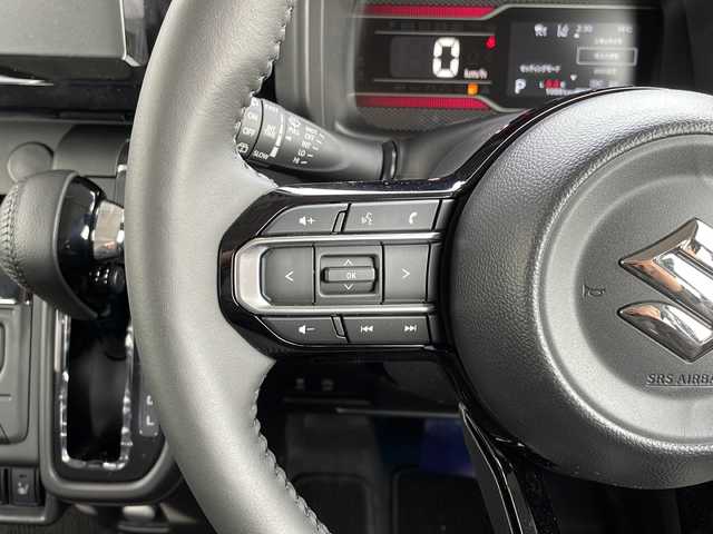 スズキ スペーシア カスタム HYBRID XS 山口県 2023(令5)年 0.1万km ブルーイッシュブラックパール3 両側パワースライドドア/プッシュスタート/スマートキー（スペアキー有）/シートヒーター（運転席＋助手席）/ステアリングヒーター/ヘッドアップディスプレイ/USB入力端子×２/オートエアコン/オートライト/LEDヘッドライト/フォグライト/サーキュレーター/アームレストコンソールボックス/助手席シートアンダーボックス/電動格納ミラー/スズキセーフティサポート/・デュアルセンサーブレーキサポート/・誤発進抑制機能/・車線逸脱抑制機能/・ふらつき警報/・車線維持支援機能/・発進お知らせ機能/・標識認識機能/・アダプティブクルーズコントロール/・低速時ブレーキサポート/・後方誤発進抑制機能