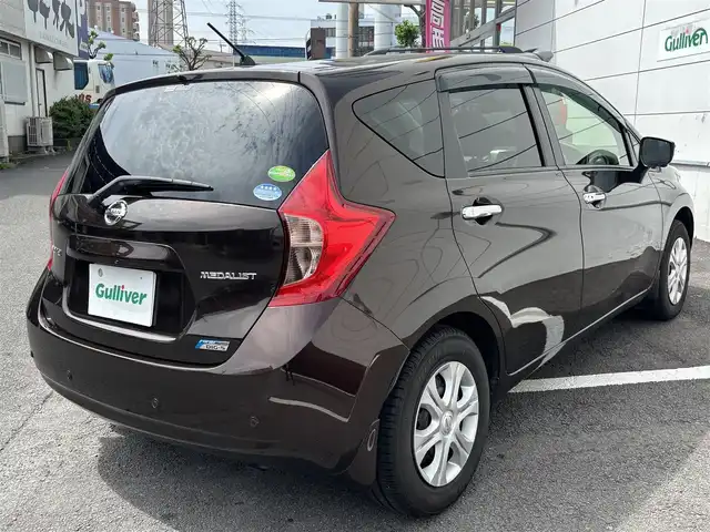 日産 ノート メダリスト  Vセレクション+セーフティⅡ 長崎県 2016(平28)年 6.1万km インペリアルアンバーP ワンオーナー/純正メモリナビ/（フルセグ/CD/DVD/BT）/アラウンドビューモニター/衝突軽減ブレーキ/横滑り防止装置/レーンアシスト/オートライト/ドアバイザー/プッシュスタート/ETC/電格ミラー/取扱説明書/保証書