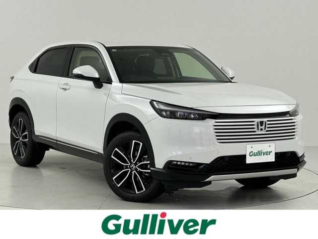 ホンダ ヴェゼル ハイブリッド e:HEV Z 大阪府 2025(令7)年 0.1万km未満 プラチナホワイトパール Honda SENSING/・衝突軽減ブレーキ（CMBS）/・誤発進抑制機能/・後方後発進抑制機能/・近距離衝突軽減ブレーキ/・歩行者事故軽減ステアリング/・路外逸脱抑制機能/・渋滞追従機能付アダプティブクルーズコントロール（ACC）/・車線維持支援システム（LKAS）/・トラフィックジャムアシスト（渋滞運転支援機能）/・先行車発進お知らせ機能/・標識認識機能/・オートハイビーム/・パーキングセンサーシステム/・急アクセル抑制機能/・アダプティブドライビングビーム/・ブラインドスポットインフォメーション/Honda CONNECTディスプレー+ETC2.0車載器(ナビゲーション連動)/ワイヤレス充電器/D/N席シートヒーター/ステアリングヒーター/純正18インチアルミホイール/フルセグTV/コーナーセンサー