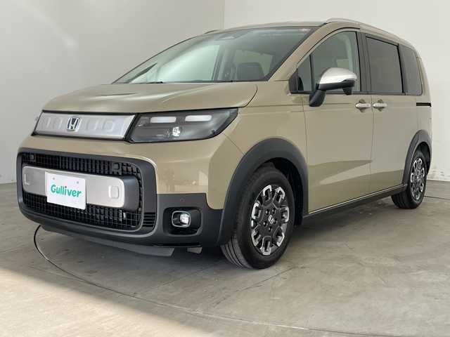 ホンダ フリード ハイブリット e:HEV クロスター 兵庫県 2025(令7)年 0.1千km ベージュ ・登録済未使用車/・衝突軽減ブレーキ/・路外逸脱抑制機能/・踏み間違い衝突軽減システム/・オートハイビーム/・アダプティブクルーズコントロール/・コーナーセンサー/・先行車発進告知/・BSM/・純正9インチナビ＆フルセグ＆BT＆USB/・バックカメラ/・両側パワースライドドア/・ハーフレザーシート/・前席シートヒーター/・LEDヘッドライト/・フォグ/・オートライト/・スマートキー/・スペアキー/・プッシュスタート/・2列目サーキュレーター/・2列目サンシェード