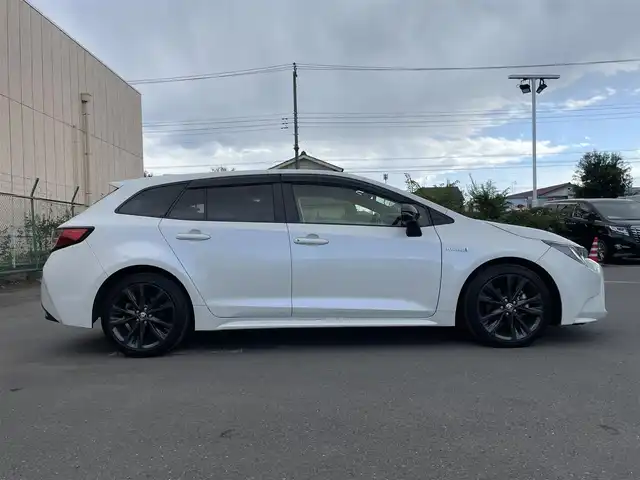 トヨタ カローラツーリング ハイブリッド ダブルバイビー 東京都 2019(令1)年 3.8万km ホワイトパールクリスタルシャイン 9インチディスプレイオーディオ/・バックカメラ/・フルセグテレビ/・Bluetooth/・スマートフォン連携（Apple CarPlay/Android Auto）/・AM/FM/ヘッドアップディスプレイ/トヨタセーフティーセンス/・プリクラッシュセーフティ/・レーントレーシングアシスト/・レーンディパーチャーアラート/・レーダークルーズコントロール（全車速追従機能）/ブラインドスポットモニター/純正フロアマット/ETC/スマートキー/プッシュスタート