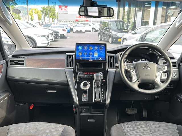 三菱 デリカＤ：５ P 大阪府 2023(令5)年 2.9万km グラファイトグレーメタリック/ブラックマイカ 社外10型ナビ　CD DVD BT フルセグTV HDMI アップルカープレイ　SD 全方位カメラ　BSM 両側パワースライドドア　パワーバックドア  前席シートヒーター  AC100V パドルシフト　パワーシート  LEDオートライト　スマートキー  レーダークルコン