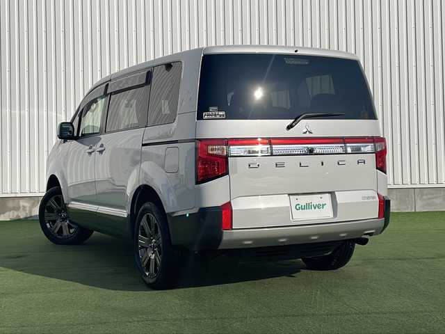 三菱 デリカＤ：５ ジャスパー 香川県 2023(令5)年 1.5万km ホワイトダイヤモントド/グラファイトグレーメタリック 三菱e-Assist/・衝突軽減ブレーキ/・車線逸脱警報/・アダプティブクルーズコントロール/・オートハイビームアシスト/・ブラインドスポットモニター/純正10.1型ナビ/【CD.DVD.USB.SD.BT】/フルセグTV/全方位カメラ　/リラックスルームイルミネーション/両側電動スライド　/パワーバックドア/パワーシート　/シートヒーター　/ハーフレザーシート/ハンドルヒーター　/パドルシフト　/革巻きステアリング　/ＬＥＤライト　/ＬＥＤフォグライト/電動パーキングブレーキ/オートホールド/ドライブレコーダー　/ETC/シートカバー/電動パーキングブレーキ