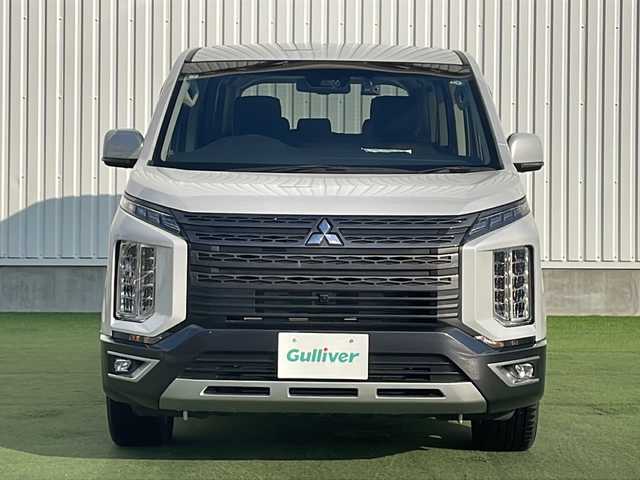 三菱 デリカＤ：５ ジャスパー 香川県 2023(令5)年 1.5万km ホワイトダイヤモントド/グラファイトグレーメタリック 三菱e-Assist/・衝突軽減ブレーキ/・車線逸脱警報/・アダプティブクルーズコントロール/・オートハイビームアシスト/・ブラインドスポットモニター/純正10.1型ナビ/【CD.DVD.USB.SD.BT】/フルセグTV/全方位カメラ　/リラックスルームイルミネーション/両側電動スライド　/パワーバックドア/パワーシート　/シートヒーター　/ハーフレザーシート/ハンドルヒーター　/パドルシフト　/革巻きステアリング　/ＬＥＤライト　/ＬＥＤフォグライト/電動パーキングブレーキ/オートホールド/ドライブレコーダー　/ETC/シートカバー/電動パーキングブレーキ
