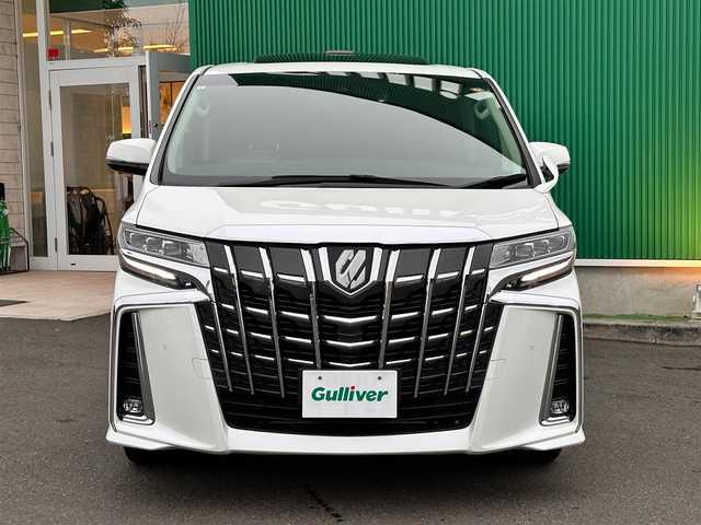 トヨタ アルファード S Cパッケージ 宮城県 2023(令5)年 3.7万km ホワイトパールクリスタルシャイン ツインムーンルーフ/デジタルインナーミラー/ブラインドスポットモニター/パーキングサポートブレーキ（後方接近車両）/スペアタイヤ/＝＝＝/セーフティセンス/・プリクラッシュセーフティ/・レーントレーシングアシスト/・ロードサインアシスト/・アダプティブハイビームシステム/・レーダークルーズコントロール（全車速追従機能付）/パーキングサポートブレーキ（前後方静止物）/純正12インチフリップダウンモニター/9インチディスプレイオーディオ/・ナビ機能付/・Bluetooth/・フルセグTV/バックカメラ/ビルトインETC/ドライブレコーダー/AC100V/100Wコンセント/パワーバックドア/両側パワースライドドア/合皮シート/シートヒーター/ベンチレーション/パワーシート（運転席メモリー機能付）/ウッドコンビステアリング/ステアリングヒーター/電動パーキングブレーキ/ブレーキホールド/3眼LEDヘッドランプ/スマートキー＆プッシュスタート/純正18インチAW/フロアマット/W/サイド/カーテンエアバッグ