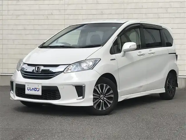 ホンダ フリード ハイブリット ジャストセレクション 栃木県 2015(平27)年 8.3万km ホワイトオーキッドパール 株)IDOMが運営する【じしゃロン小山店】の自社ローン専用車両になります。こちらは現金またはオートローンご利用時の価格です。自社ローンご希望の方は別途その旨お申付け下さい//禁煙車/純正フルセグナビ/（CD/DVD/AM/FMラジオ）/(Bluetooth)/スマートキー/バックカメラ/クルーズコントロール/ＥＴＣ/パワースライドドア/ステアリングリモコン/電動格納ドアミラー/パワーウインドウ/防眩ミラー/オートライト