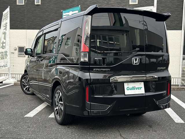 ホンダ ステップワゴン スパーダ クルスピセンシング 三重県 2021(令3)年 3.4万km プレミアムスパークルブラックパール 登録時33448km/ワンオーナー/禁煙車/ハーフレザーシート/純正Gathersナビ/（AM/FM/TV/Bluetooth/CD/DVD/USB）/フルセグTV/バックカメラ/ビルトインETC2.0/ステアリングスイッチ/パドルシフト/レーダークルーズコントロール/両側パワースライドドア/わくわくゲート/シートヒーター/オートライト/衝突軽減システム/車線逸脱防止機能/ISOFIX/アイドリングストップ/プッシュスタート/純正17インチアルミ/カーテンエアバック/スペアキー/取説/保証書