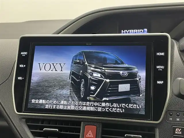 トヨタ ヴォクシー ハイブリッド ZS 煌Ⅲ 岡山県 2021(令3)年 4.5万km ブラック 純正10インチSDナビ/・バックカメラ/・FM/AM/Bluetooth/フルセグ/CD/DVD/トヨタセーフティーセンス/・プリクラッシュセーフティ/・レーンディパーチャーアラート/・クルーズコントロール/・オートマチックハイビーム/・誤発信抑制機能/・コーナーセンサー/ハーフレザーシート/・D/Nシートヒーター/両側パワースライドドア/ETC/純正16インチアルミ/純正フロアマット/リアサンシェード/LEDヘッドライト/スマートキー×2/取扱説明書
