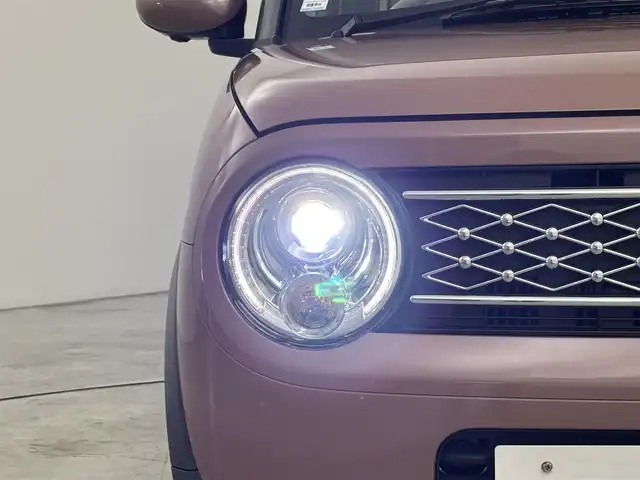スズキ ラパン X 福岡県 2024(令6)年 0.2万km テラコッタピンクメタリック 社外ナビ／フルセグＴＶ　/全方位モニター対応　/プッシュスタート　/コーナーセンサー　/衝突軽減ブレーキ　/レーンキープ　/アイドリングストップ　/シートヒーター　/電動格納式ドアミラー　/純正１４インチアルミホイール