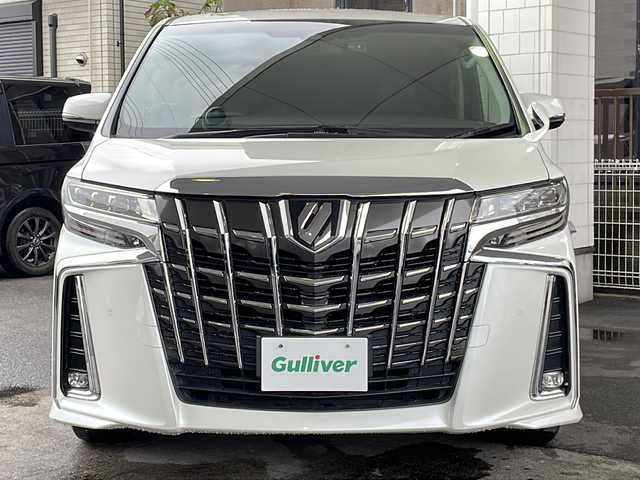 トヨタ アルファード S Cパッケージ 京都府 2018(平30)年 7.7万km ホワイトパールクリスタルシャイン 純正９インチナビ/（NSZT-Y66T）/AM/FM/CD/DVD/Bluetooth/HDMI/バックカメラ/フルセグＴＶ/レーダークルーズコントロール/純正フリップダウンモニター/（12.1インチ）/両側パワースライドドア/パワーリアゲート/三眼ＬＥＤヘッドライト/メモリー付きパワーシート/合皮シート/オットマン/前席シートヒーター/前席ベンチレーション/ステアリングヒーター/ビルトインETC/ドライブレコーダー/AFC（アダプティブフロントライティングシステム）/オートマチックハイビーム/オートライト/前後コーナーセンサー/レーンキープアシスト/ダブルエアバッグ＆サイドエアバッグ/カーテンエアバッグ/衝突被害軽減ブレーキ/純正18インチホイール/純正フロアマット/横滑り防止装置/盗難防止装置/ABS