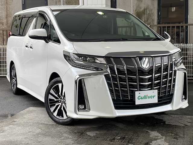トヨタ アルファード S Cパッケージ 京都府 2018(平30)年 7.7万km ホワイトパールクリスタルシャイン 純正９インチナビ/（NSZT-Y66T）/AM/FM/CD/DVD/Bluetooth/HDMI/バックカメラ/フルセグＴＶ/レーダークルーズコントロール/純正フリップダウンモニター/（12.1インチ）/両側パワースライドドア/パワーリアゲート/三眼ＬＥＤヘッドライト/メモリー付きパワーシート/合皮シート/オットマン/前席シートヒーター/前席ベンチレーション/ステアリングヒーター/ビルトインETC/ドライブレコーダー/AFC（アダプティブフロントライティングシステム）/オートマチックハイビーム/オートライト/前後コーナーセンサー/レーンキープアシスト/ダブルエアバッグ＆サイドエアバッグ/カーテンエアバッグ/衝突被害軽減ブレーキ/純正18インチホイール/純正フロアマット/横滑り防止装置/盗難防止装置/ABS