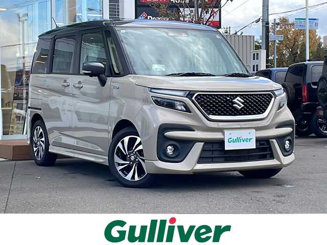 スズキ ソリオ バンディット HV MV 道央・札幌 2023(令5)年 8.3万km キャラバンアイボリーパールM / ガンメタリック2トーン ・4WD/・純正９インチナビ/(フルセグ/AM/FM/CD/DVD/BT)/・全方位カメラ/・衝突軽減ブレーキ/・純正ドライブレコーダー/・両側パワースライドドア/・D席/N席シートヒーター/・冬タイヤ　15インチ積込/・純正　15インチAW/・純正フロアマット/・アイドリングストップ/・クルーズコントロール（追従走行有）/・リアコーナーセンサー/・レーンキープアシスト/・LEDヘッドライ/・オートライト/・フォグランプ/・ポップアップディスプレイ/・盗難防止装置/・ABS/・横滑り防止装置/・スマートキー/・プッシュスタート/・スペアキー/・USB充電typeAtypeC/・後席サーキュレーター