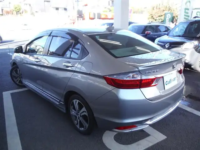 ホンダ グレイス ハイブリッド EX 東京都 2015(平27)年 7.3万km グレー ワンオーナー車/保証書あり/純正ナビ・TV/　BLUETOOTH・HDMI/　バックカメラ・ビルトインETC/ドライブレコーダー/ハーフレザーシート/　前席シートヒーター/あんしんパッケージ/パドルシフト/　クルーズコントロール/モデューロサイドスポイラー/LEDヘッドライト/電動コーナーポール/イルミスカッフプレート/スマートキー×2個