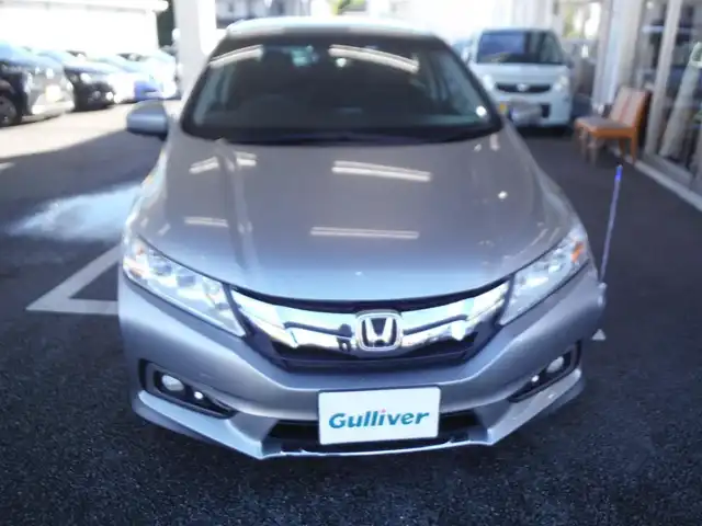 ホンダ グレイス ハイブリッド EX 東京都 2015(平27)年 7.3万km グレー ワンオーナー車/保証書あり/純正ナビ・TV/　BLUETOOTH・HDMI/　バックカメラ・ビルトインETC/ドライブレコーダー/ハーフレザーシート/　前席シートヒーター/あんしんパッケージ/パドルシフト/　クルーズコントロール/モデューロサイドスポイラー/LEDヘッドライト/電動コーナーポール/イルミスカッフプレート/スマートキー×2個