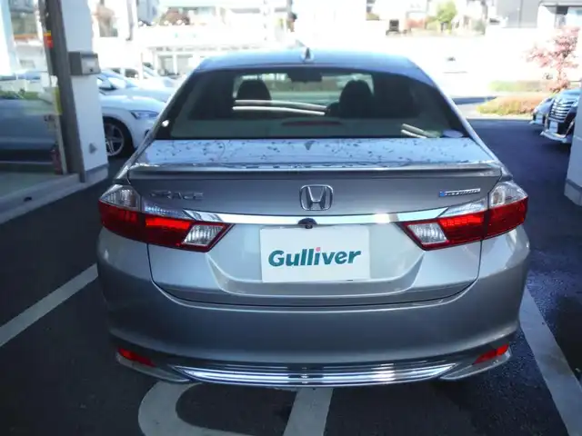 ホンダ グレイス ハイブリッド EX 東京都 2015(平27)年 7.3万km グレー ワンオーナー車/保証書あり/純正ナビ・TV/　BLUETOOTH・HDMI/　バックカメラ・ビルトインETC/ドライブレコーダー/ハーフレザーシート/　前席シートヒーター/あんしんパッケージ/パドルシフト/　クルーズコントロール/モデューロサイドスポイラー/LEDヘッドライト/電動コーナーポール/イルミスカッフプレート/スマートキー×2個